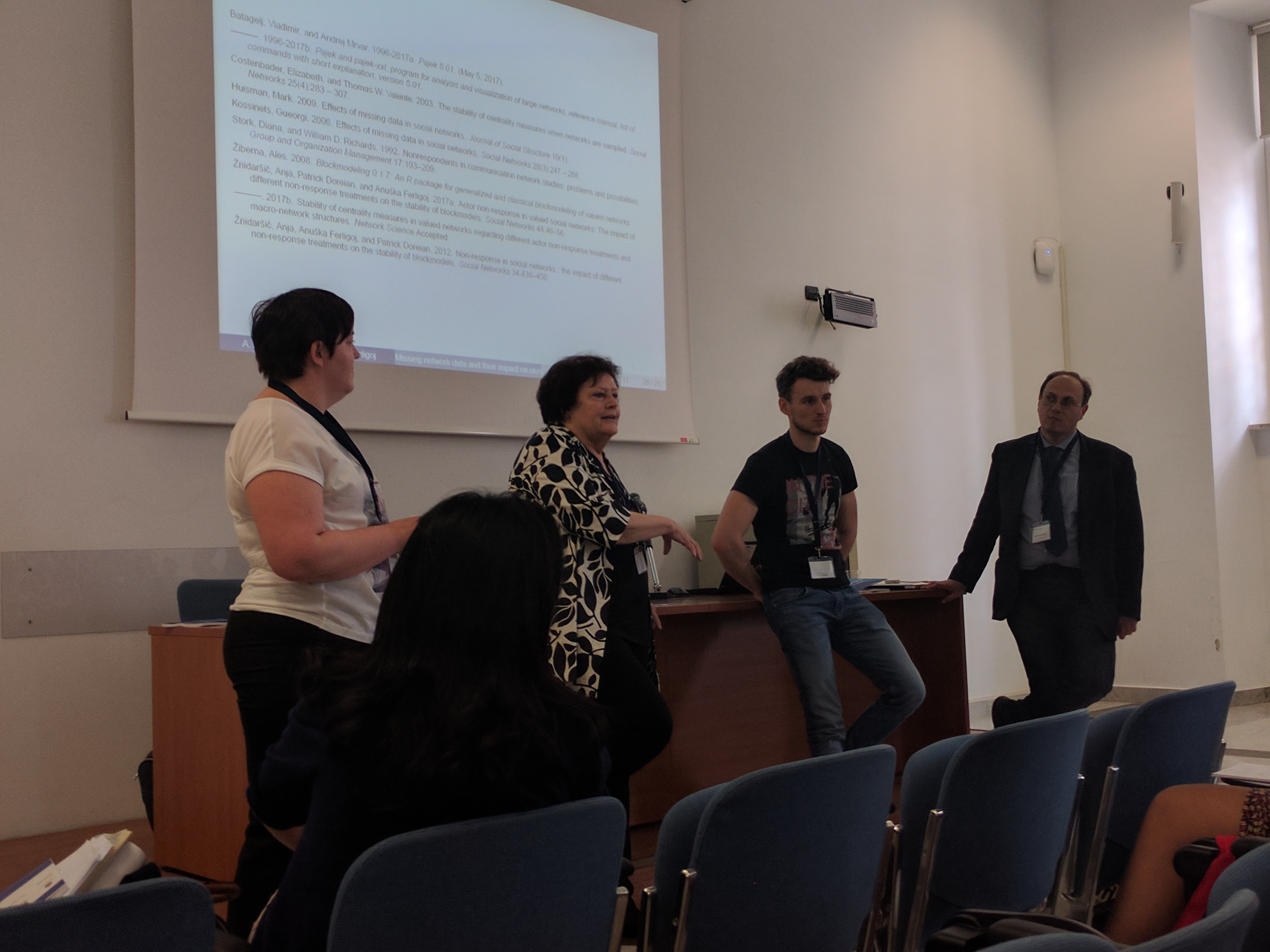 Colleagues discussing a presentation
