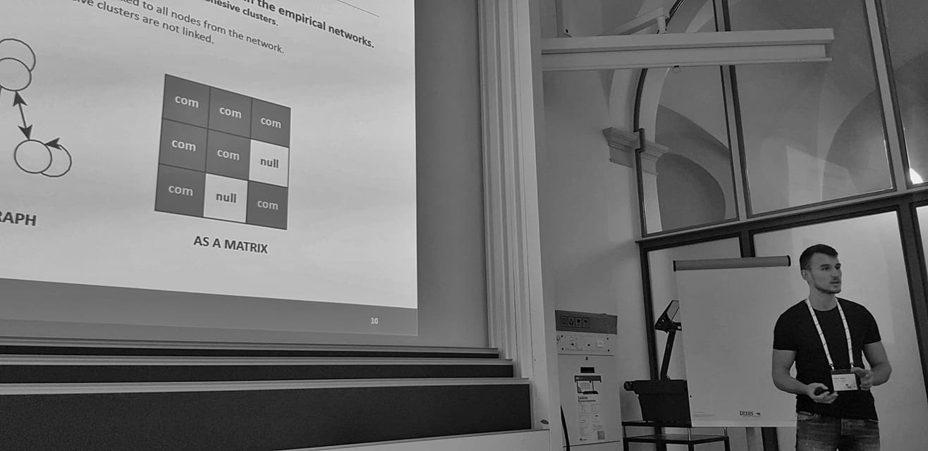 Black-and-white photograph of a Network Slovenia presentation at FDV